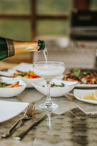 champagne poured into coupe glass