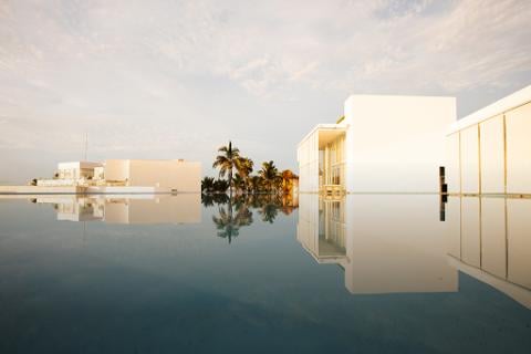 A view across the still water of a pool at Viceroy Los Cabos.