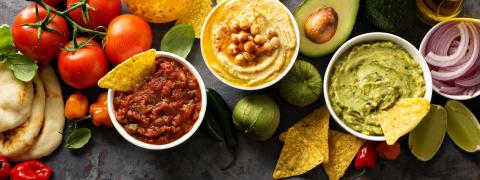A spread of dips such as hummus & Guacamole at Viceroy Los Cabos