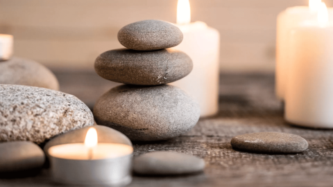 Stones and lit candles at Ombria Algarve