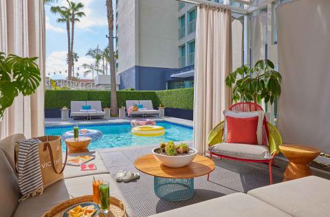 The view of the pool from a cabana filled with snacks at Viceroy Santa Monica