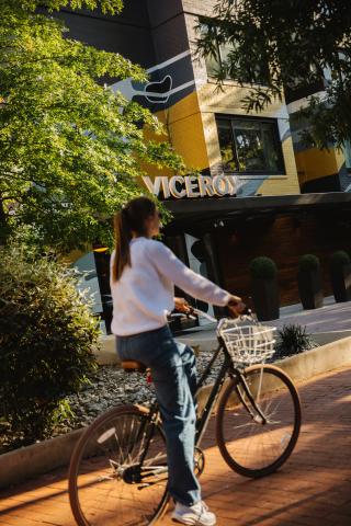 A cyclist rides their bike along a path outside Viceroy Washington DC