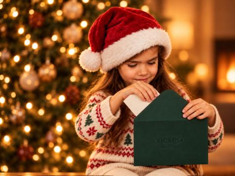 A child mailing a letter to Santa