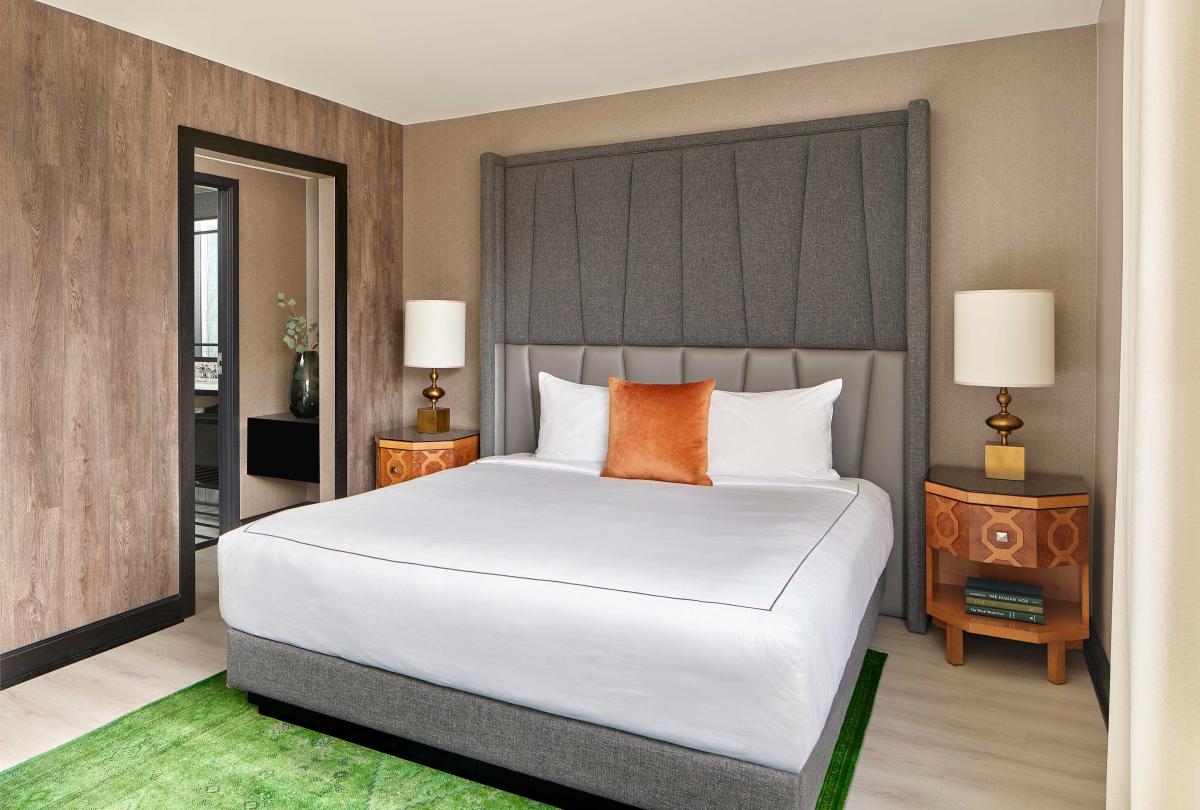 bedroom with king bed and green carpet