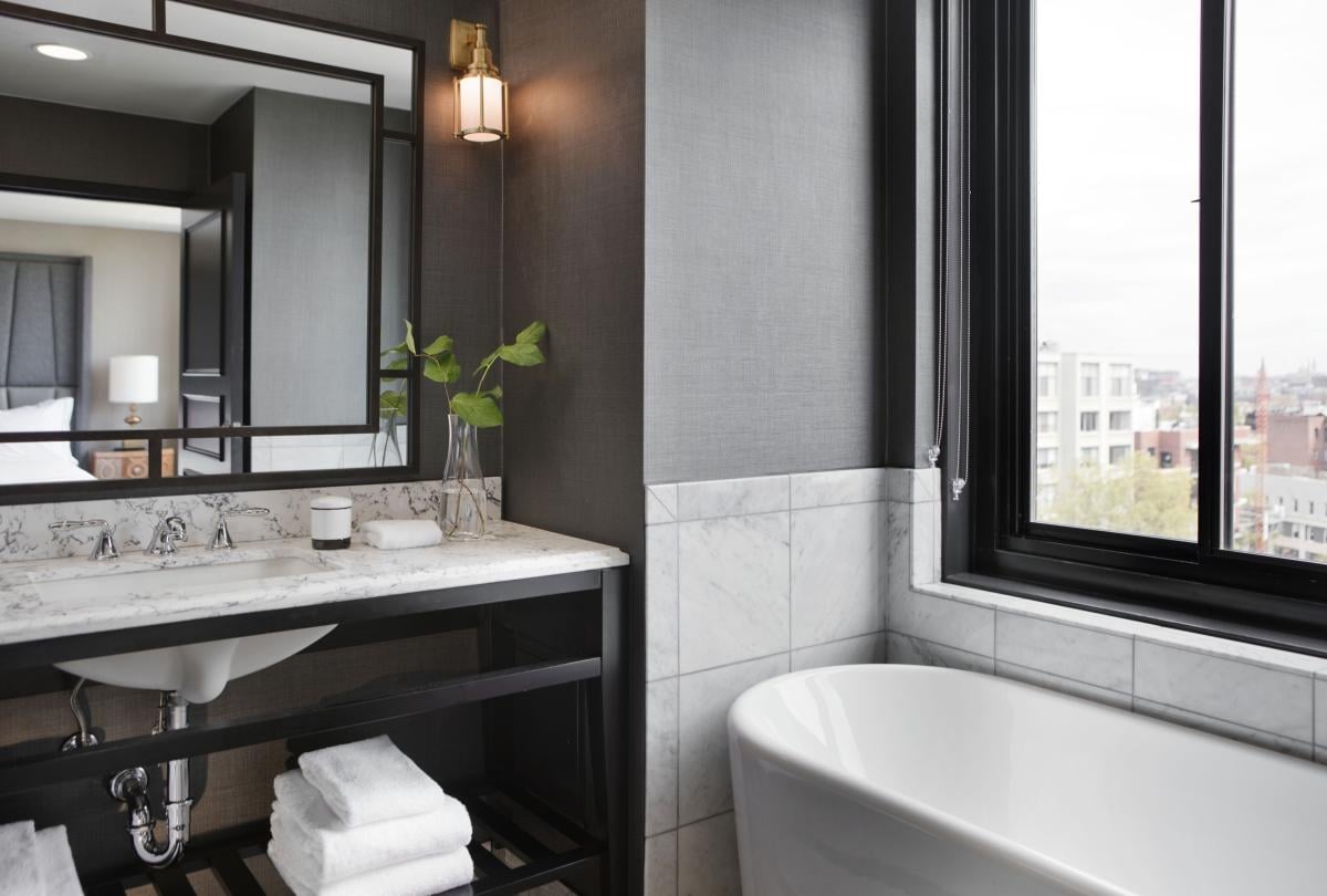 Bathroom with tub and vanity