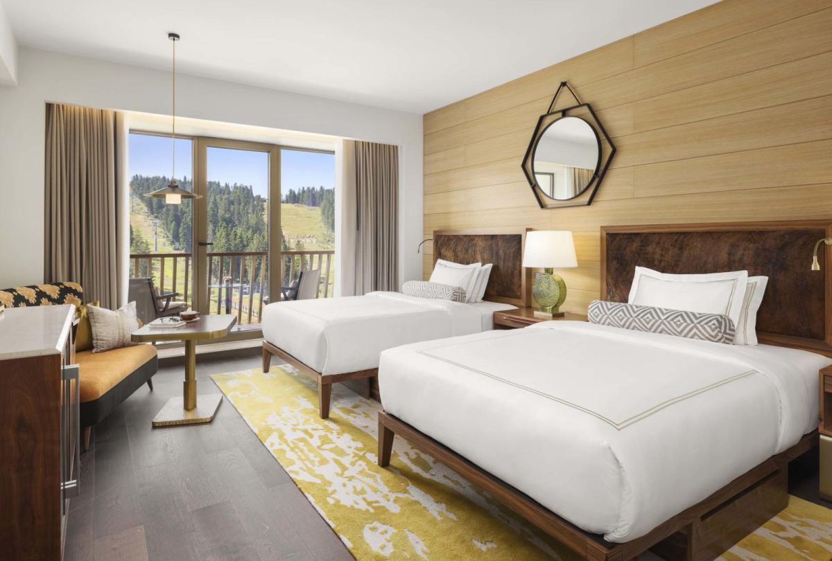 Two queen beds in a room at Viceroy Kopaonik Serbia