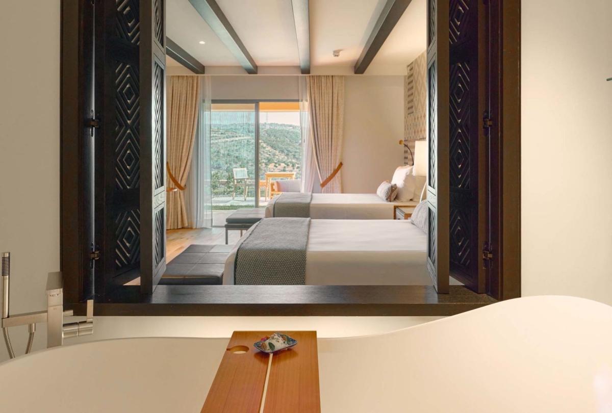 A view from the soaker tub to the bedroom in a standard room at Viceroy Ombria Algarve