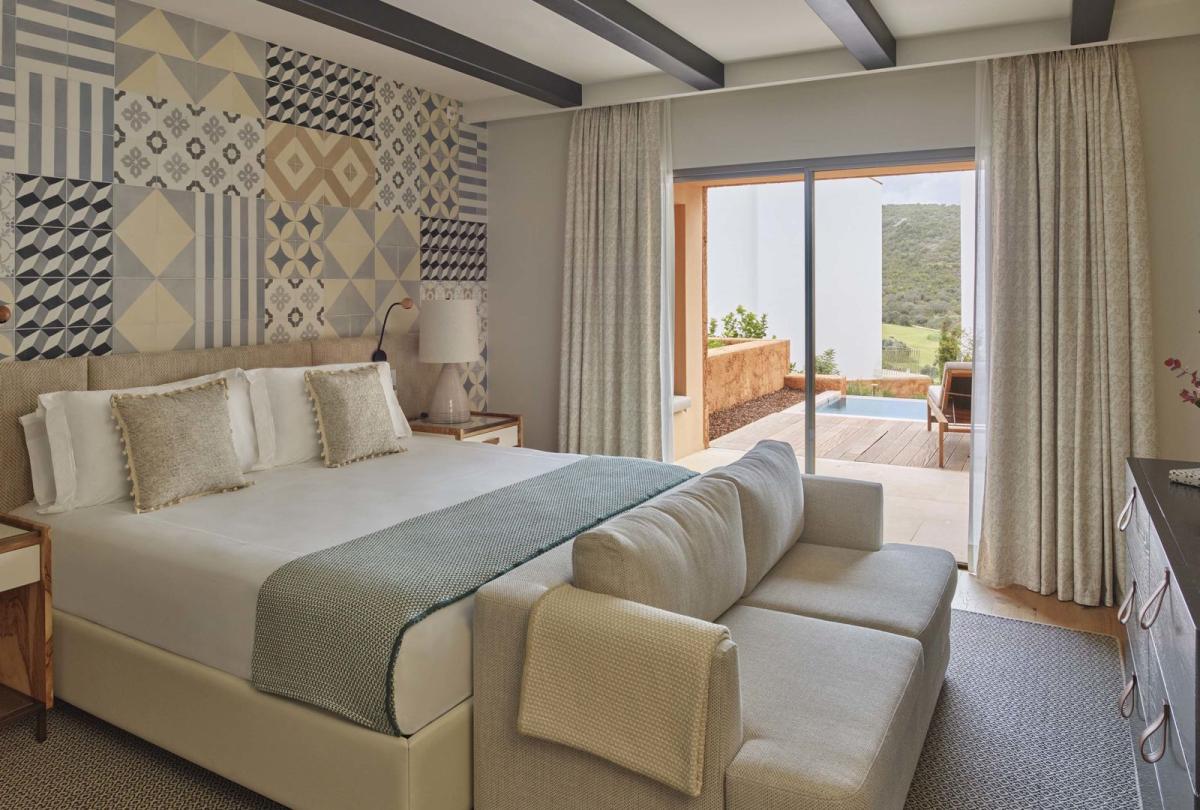 A warm bedroom with pool patio in two bedroom residence at Viceroy Ombria Algarve