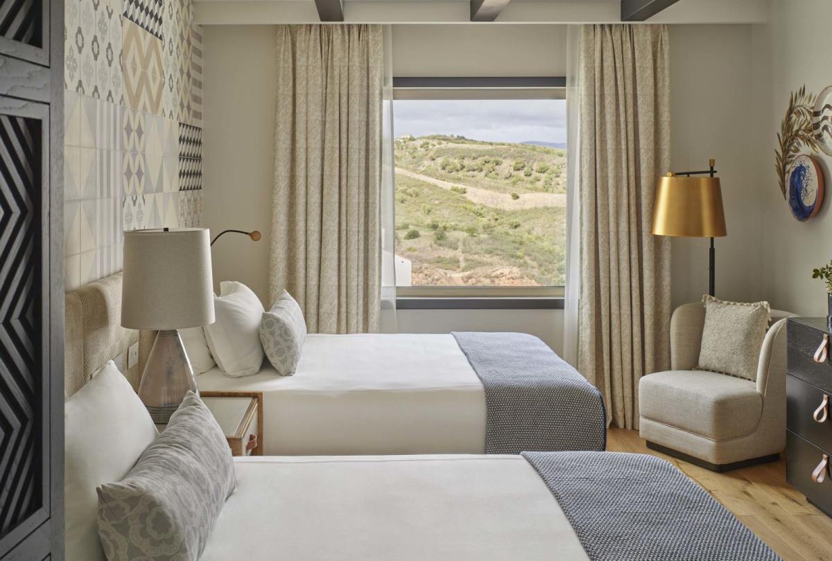 Two beds in a warm bedroom in two bedroom residence at Viceroy Ombria Algarve