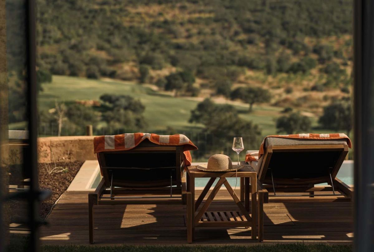 Two outdoor lounge chairs overlooking the valley at a two bedroom residence at Viceroy Ombria Algarve