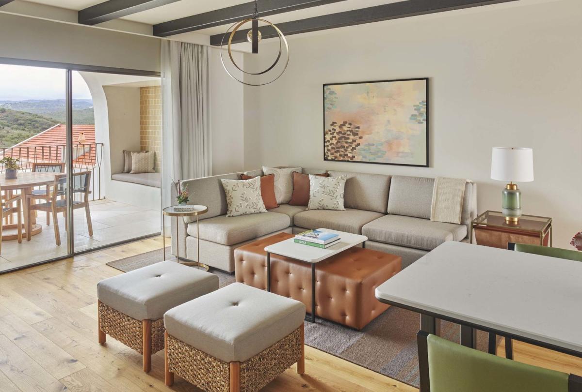 An open living room with valley view in a two bedroom residence at Viceroy Ombris Algarve