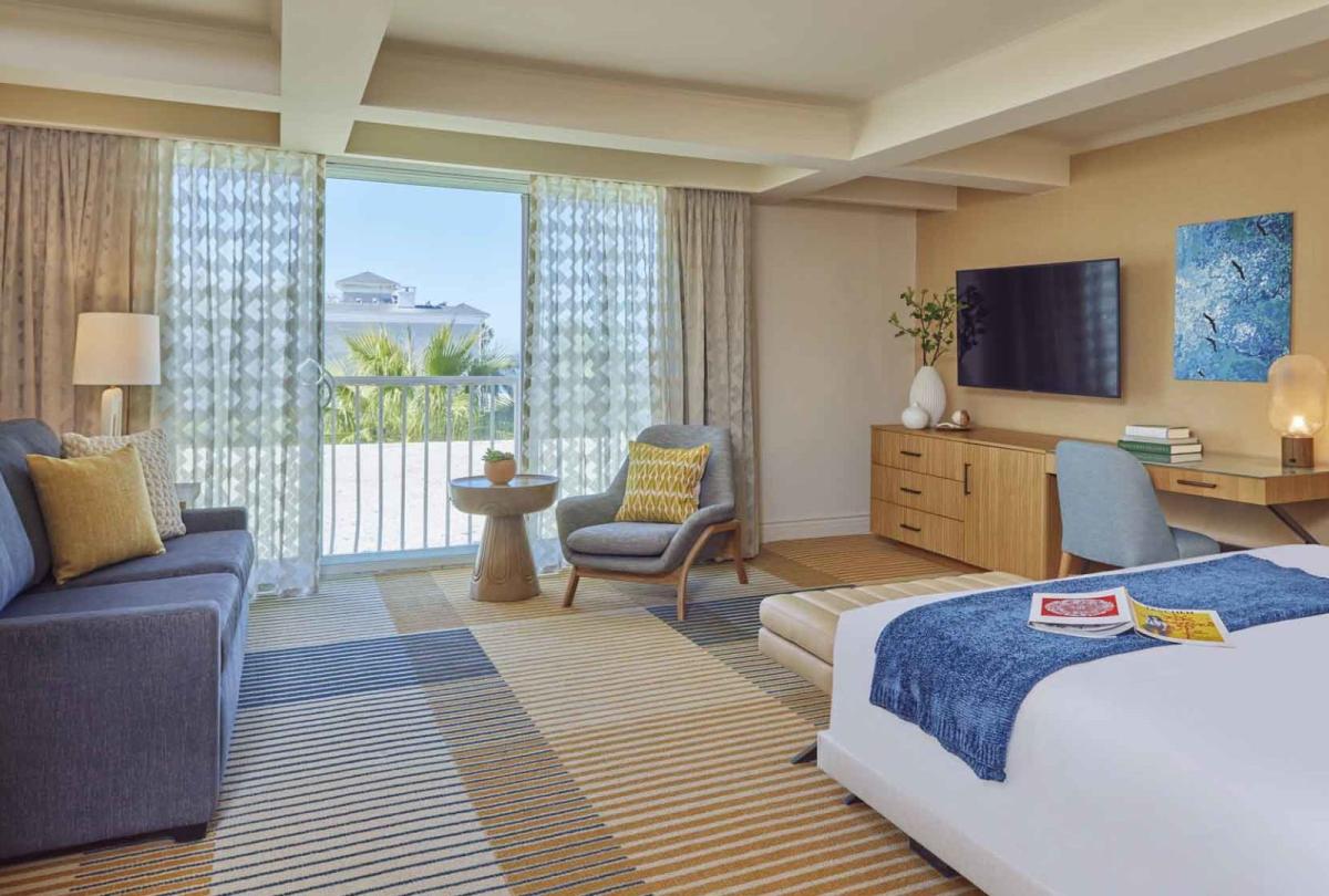 A room with a couch and a king bed at Viceroy Santa Monica