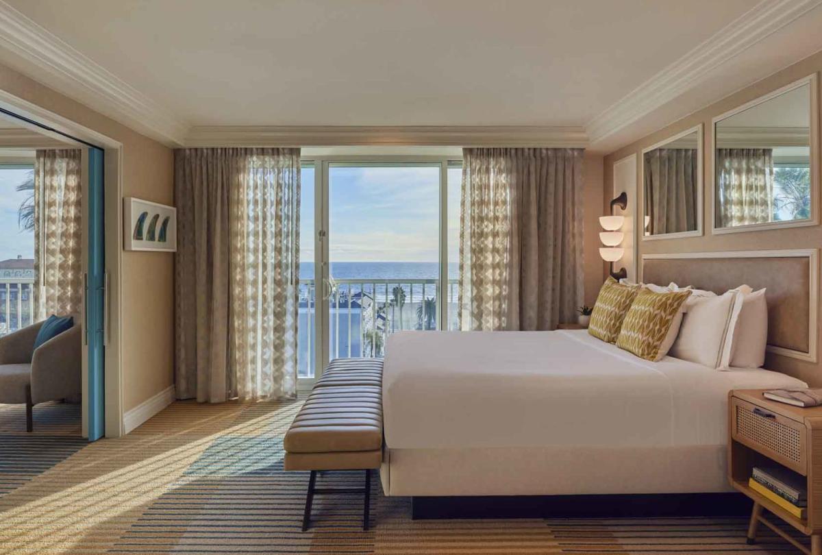 A king bed and balcony in a Junior Suite at Viceroy Santa Monica
