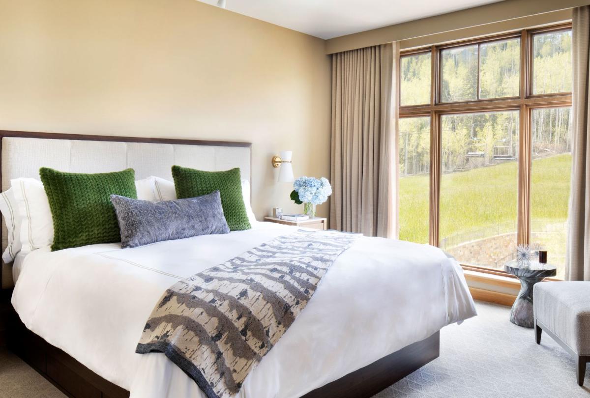 A king bed in a Pinnacle Three Bedroom Residential Suite at viceroy Snowmass