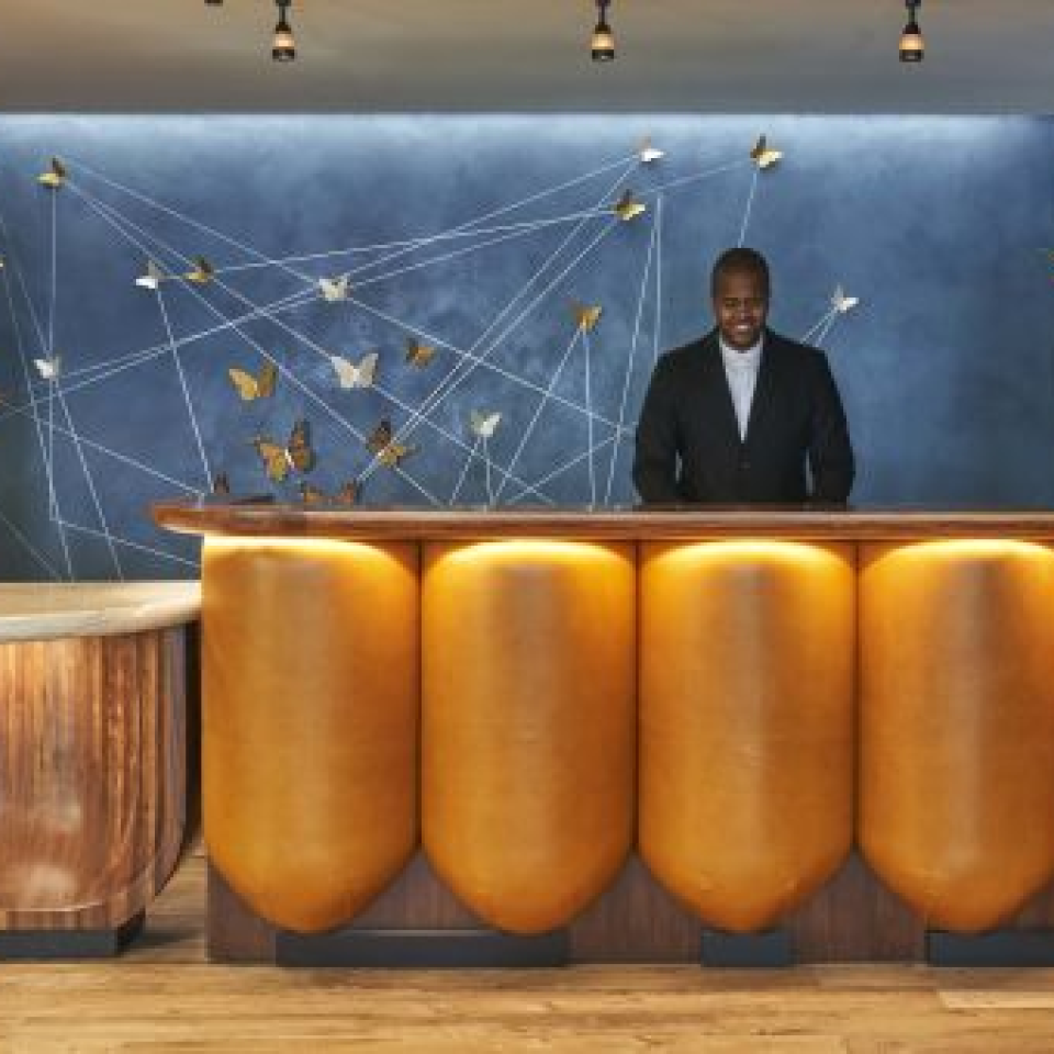 A front desk attendant at a Viceroy hotel