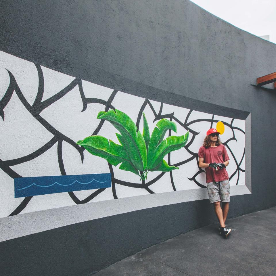 Artist Spencer Mar Guilburt posing with Deep Roots