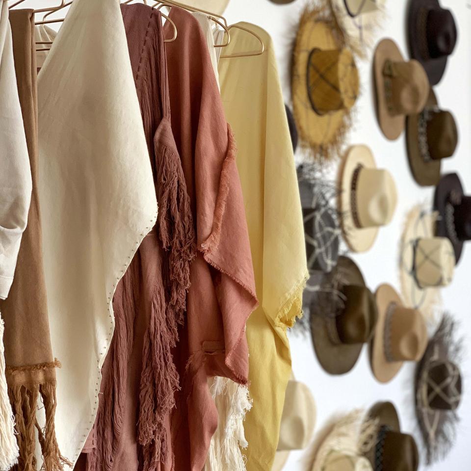 A boutique with scarves and hats on display