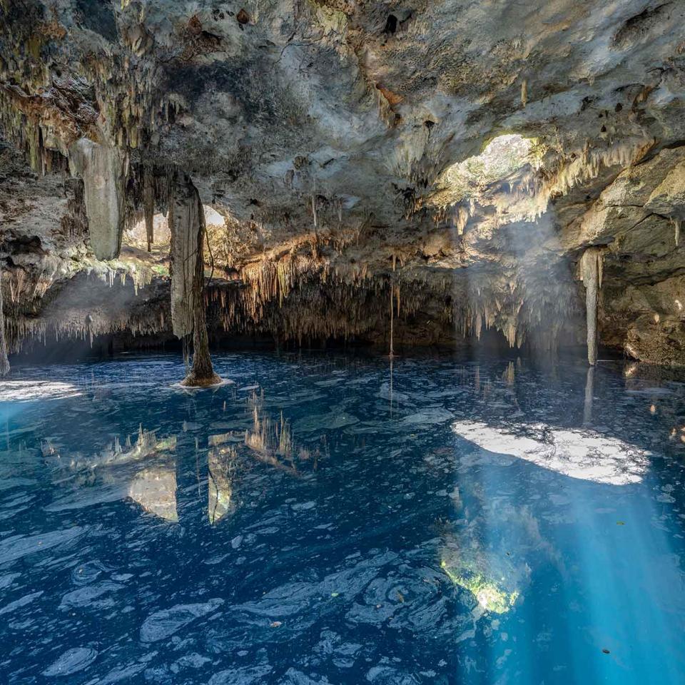 An underwater cave illuminated by sunlight