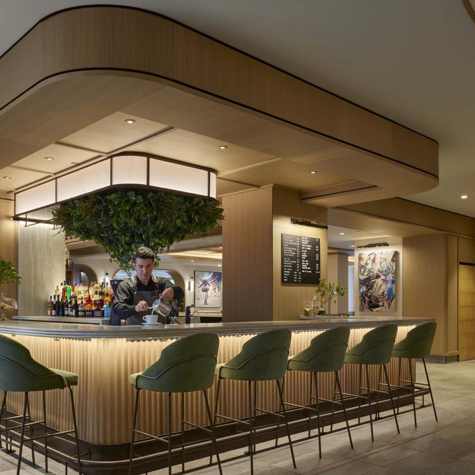 A barista prepares a latte at Café V at Viceroy Snowmass.