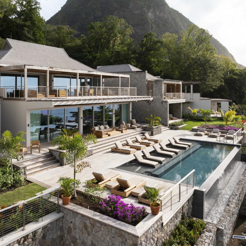 The exterior of Spice of Life Villa, with a private pool and a view of Sugar Beach and the Pitons