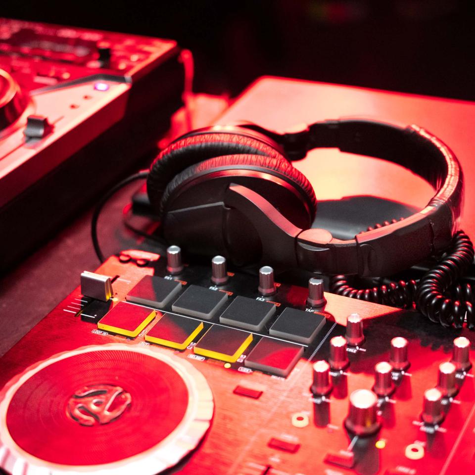 red disc jockey turntable and headphones