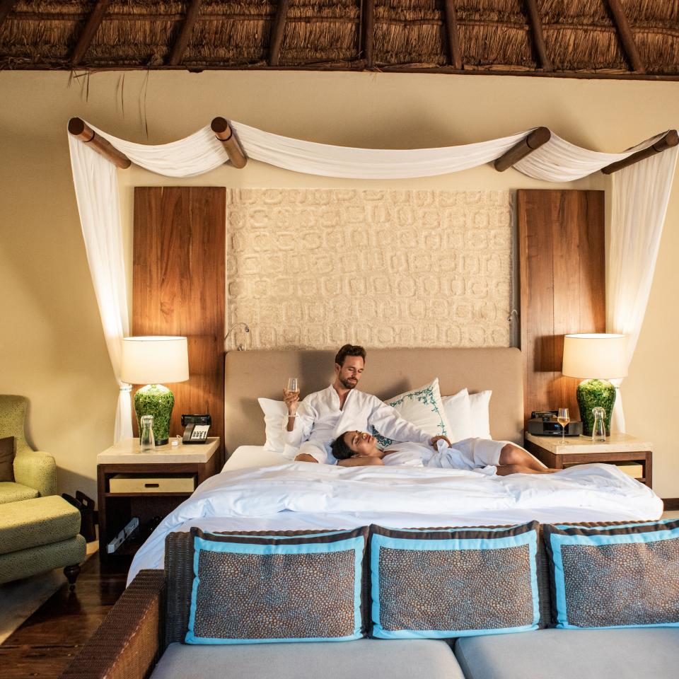 A couple resting on the bed