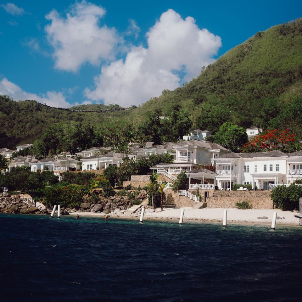A panoramic view of Sugar Beach at the base of the Piton mountains in St. Lucia