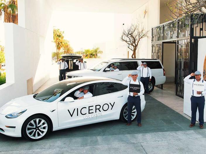 drivers stand in front of viceroy branded white vehicles