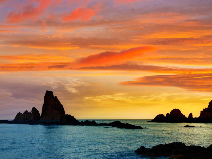 red and yellow sunset over the water