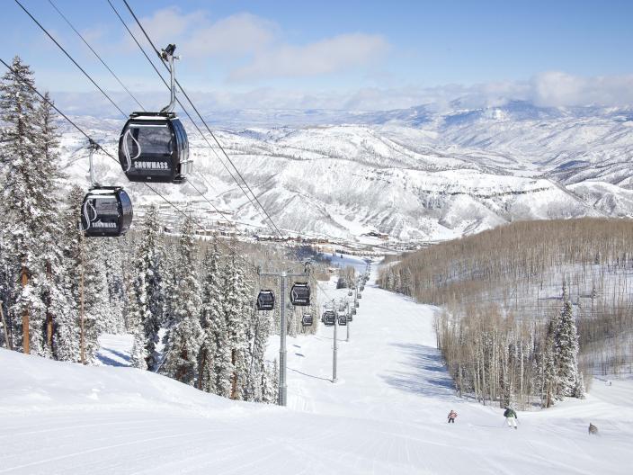 view of chairlift and ski hill from top of mountain