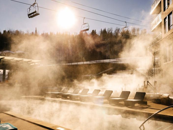 fog over pool with chair lift in the background