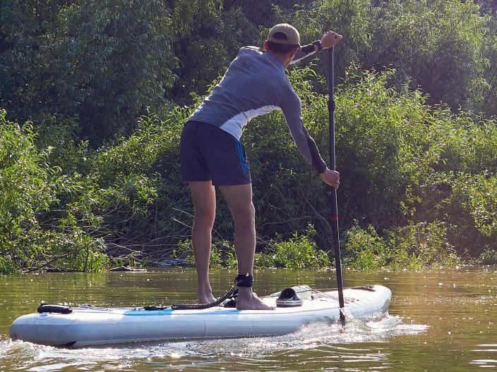 person on stand-up paddle board