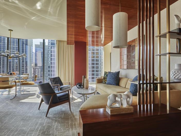 Large living room area with floor to ceiling windows