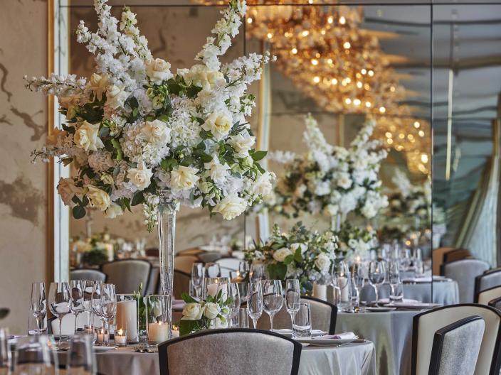 large floral centerpiece on a round table