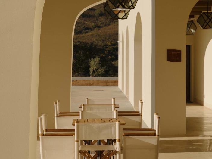 covered outdoor dining area with long table