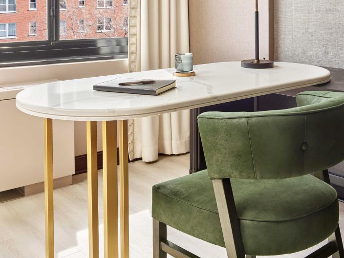 Small desk with a suede green chair