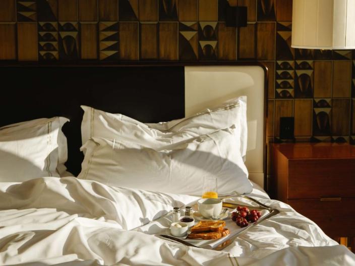 A tray of breakfast food in a Viceroy Chicago hotel room