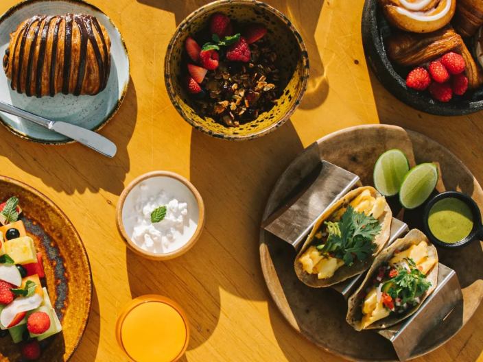 A spread of food including tacos and pastries at Viceroy Los Cabos