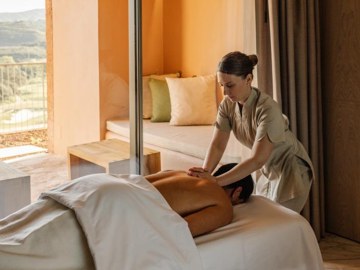 A person receiving a massage in a Viceroy Ombria Algarve hotel room