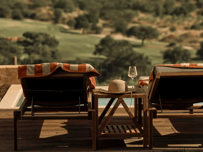 Two lounge chairs overlooking the pool at Ombria Algarve