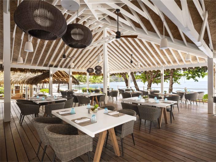 The outdoor restaurant Jalousie Grill, under a vaulted wooden roof