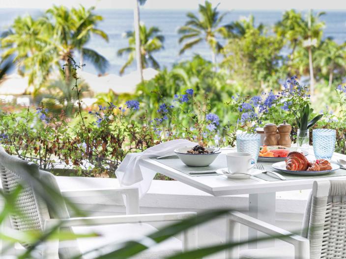 Terrace Restaurant, an outdoor dining space near the beach