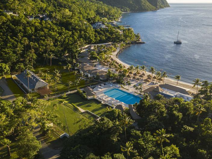 Overhead view of Viceroy Sugar Beach property with the ocean, pools, and green areas