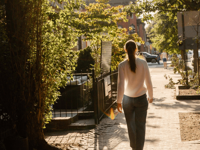 A woman walking down the street in Washington DC