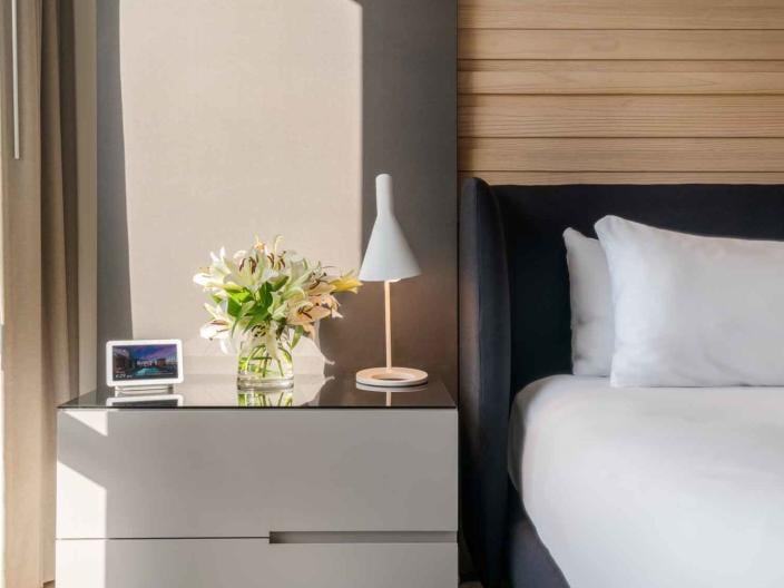 King bed and side table in a room at Viceroy Zena Washington