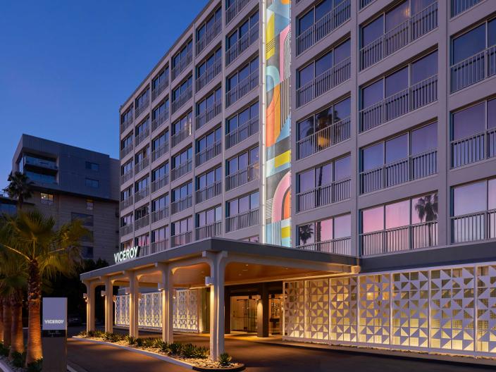 The exterior facade of Viceroy Santa Monica, with a large mural of kaleidoscopic colors ascending the building
