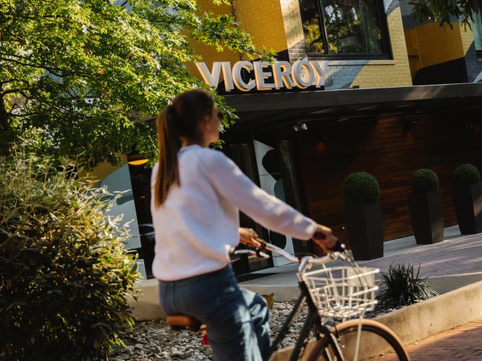 A cyclist rides their bike along a path outside Viceroy Washington DC