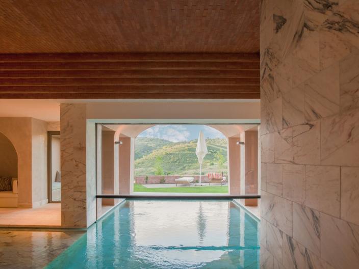 Empty pool area overlooking the lawn