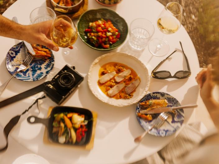 plates of food and personal items on table