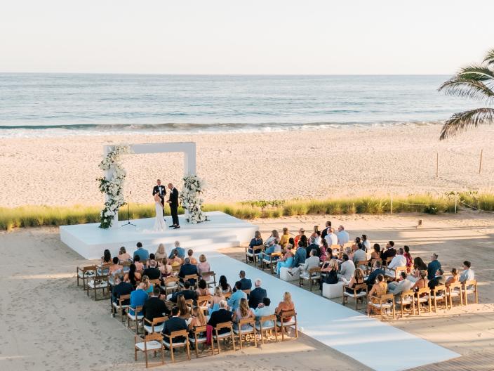 aerial view of beach with wedding set-up